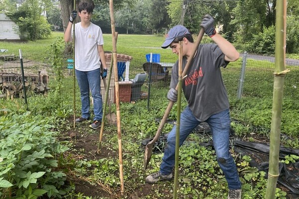 Students participating in garden service